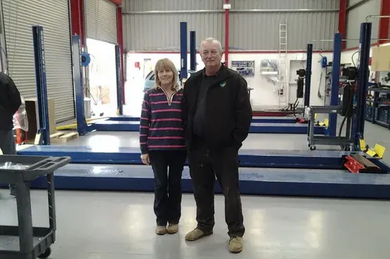Mike and Sonia at their Loxbeare garage
